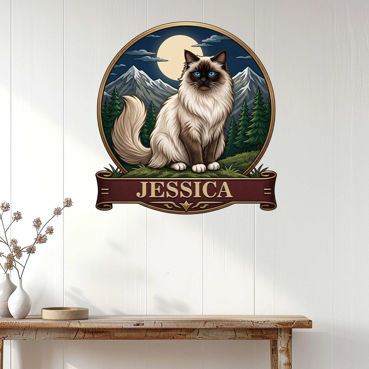 Birman cat wall sign displayed on a light paneled wall above a console table