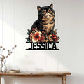 Floral Exotic Shorthair cat metal wall sign displayed on a light wood-paneled wall