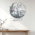 Exotic Shorthair cat wall sign displayed above a console table in a bright home