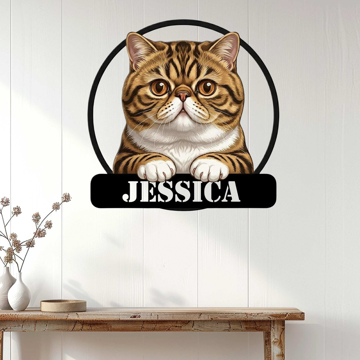 Exotic Shorthair cat wall sign displayed against white paneling above a rustic console table