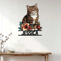 British Shorthair cat metal sign displayed on a light wood-paneled wall above a console table