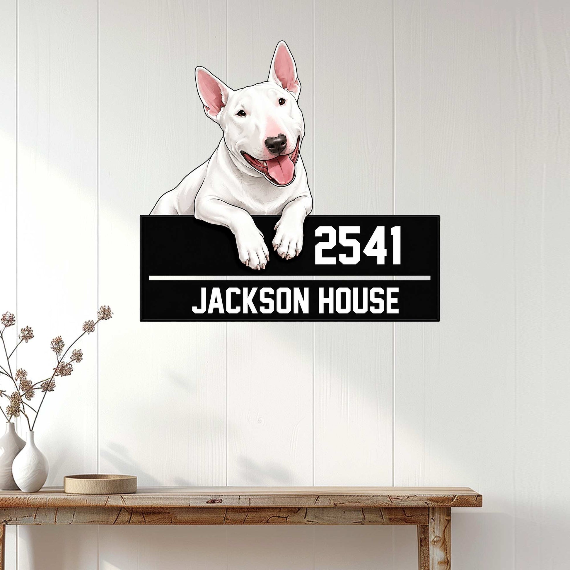 Bull Terrier wall sign displayed on a light wood-paneled wall above a console table