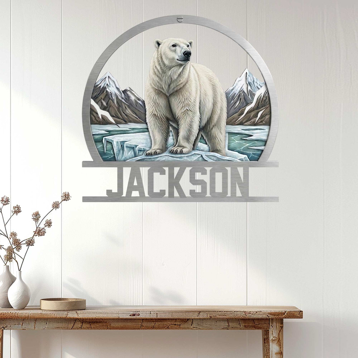 Polar bear wall sign displayed on a light paneled wall above a rustic console table