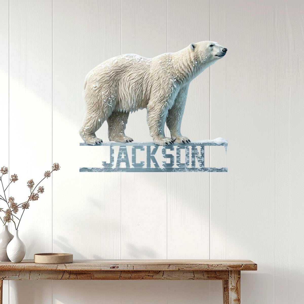 Polar bear wall sign displayed against white wood paneling in a bright home interior