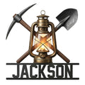 Coal miner metal sign featuring a vintage lantern with crossed pickaxe and shovel