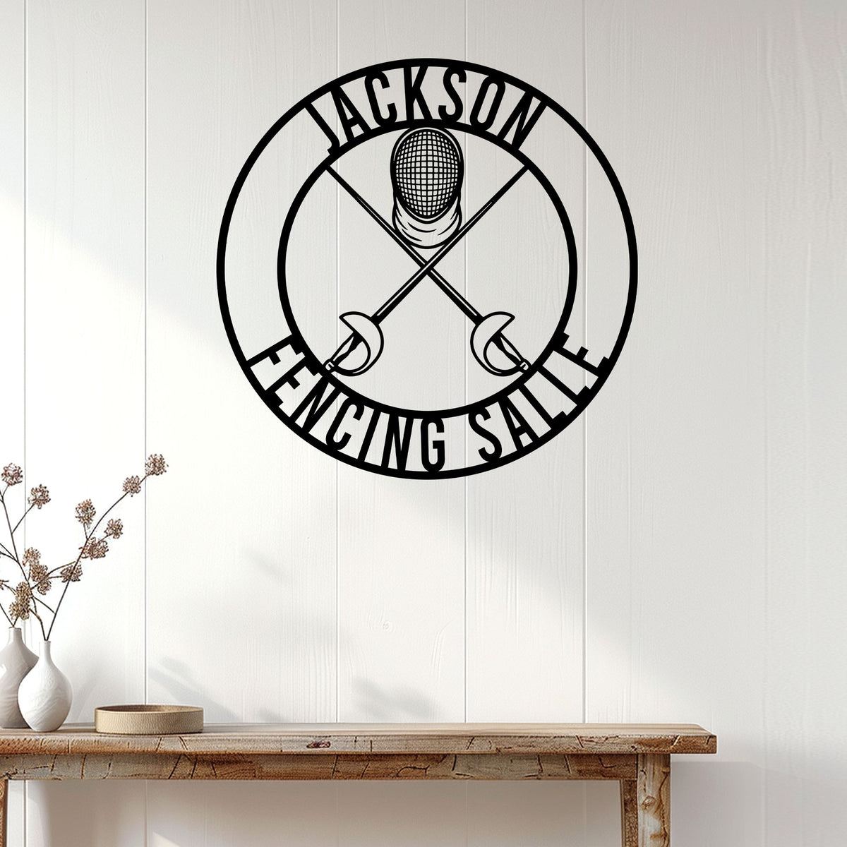 Fencing salle wall sign displayed on a light wood-paneled wall above a console table
