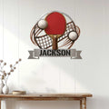 Custom ping pong metal wall sign displayed above a console table in a bright home interior