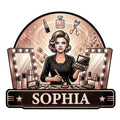 Makeup artist metal sign featuring a beauty professional, vanity mirrors, cosmetics, brushes, lipstick, and perfume