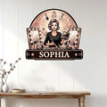 Makeup artist wall sign displayed on white wood paneling above a rustic console table