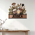 Makeup artist wall sign displayed on a white paneled wall above a console table in a bright beauty space