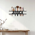 Makeup artist wall sign styled on a white wood wall above a console table