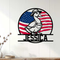 Patriotic duck metal sign displayed as wall decor on a bright white paneled wall