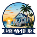 Custom beach house metal sign featuring a seaside cottage, sunset ocean view, palm trees, and coastal scenery
