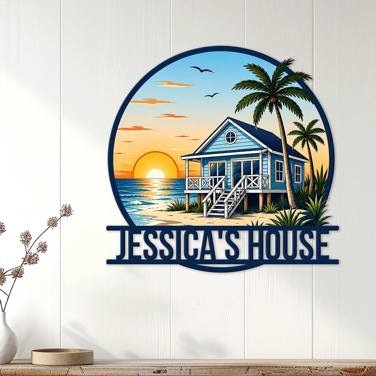 Beach house metal sign displayed on a white paneled wall as coastal home decor