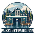 Custom boat house metal sign featuring a lakeside boathouse, dock, evergreen trees, water, and mountain scenery