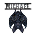 Gothic bat metal sign with wide patterned wings and a dark bat illustration beneath a bold horizontal header