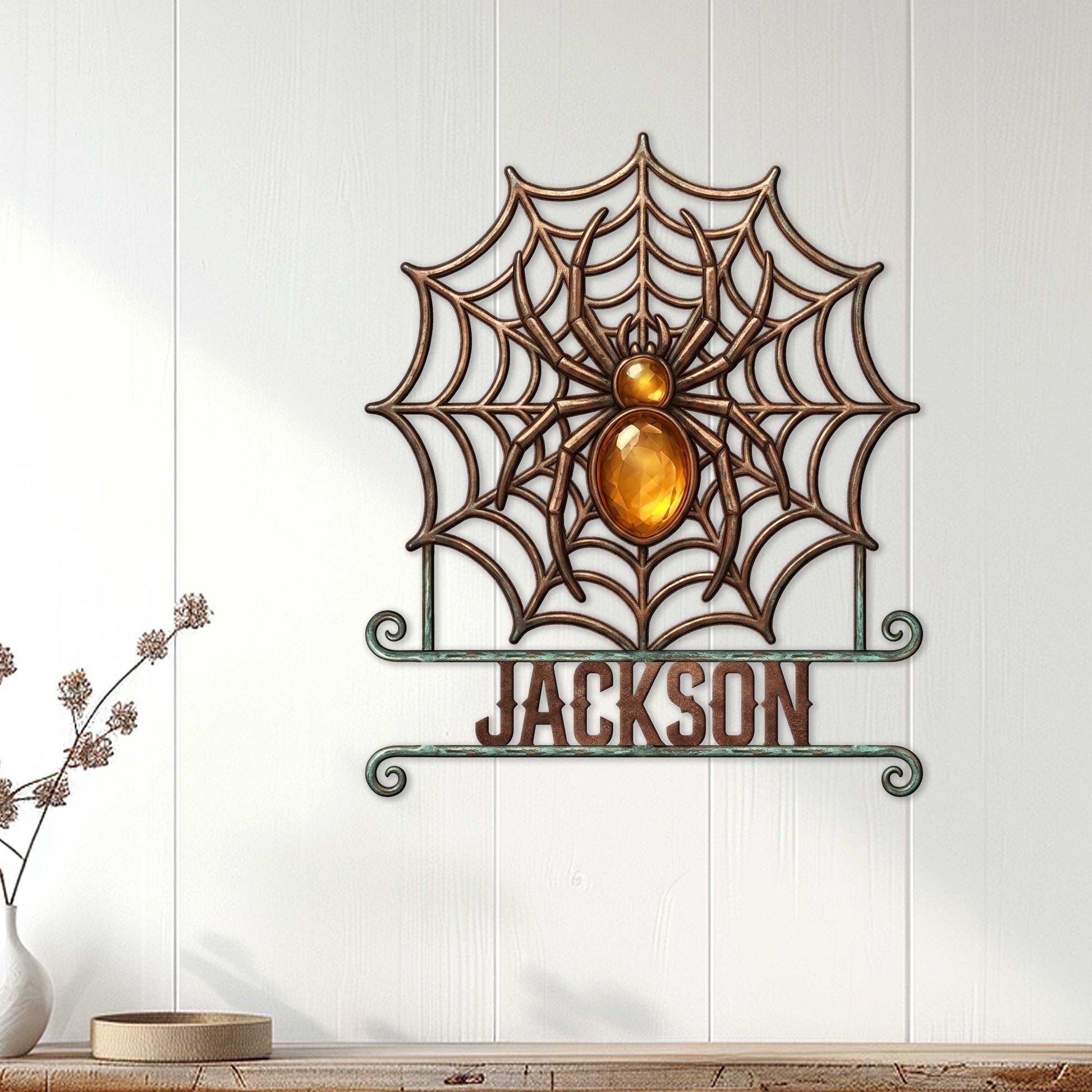 Decorative spider web metal sign displayed on a white paneled wall in a home interior