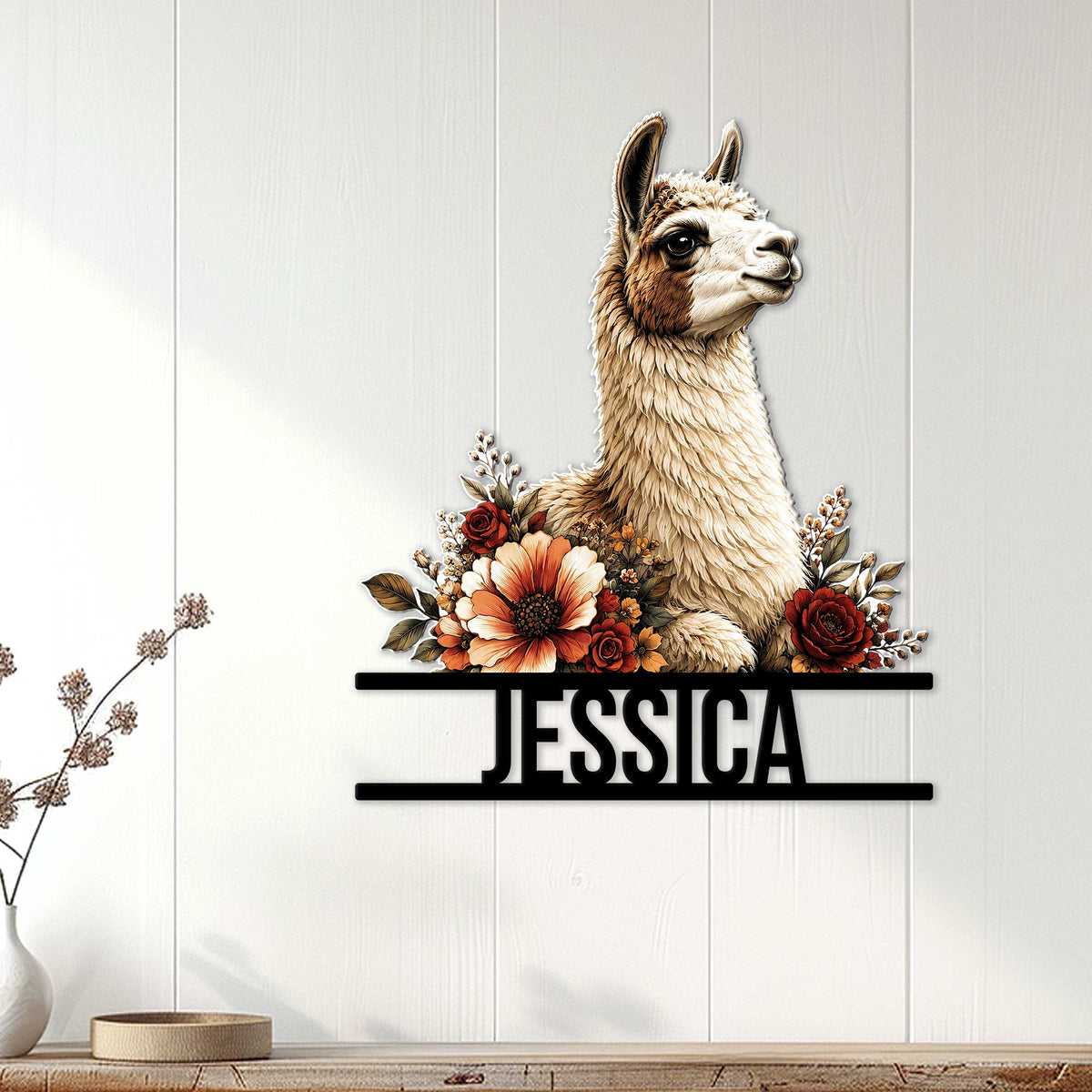 Floral llama wall sign displayed on a light wood-paneled wall in a cozy home setting
