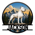 Dogo Argentino metal sign featuring a white dog standing before mountain peaks and evergreen trees