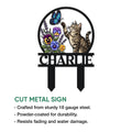Cut metal tabby cat garden sign featuring a butterfly, pansies, and a raised paw