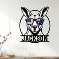 Kangaroo metal wall sign displayed on a light wood-paneled wall in a modern home interior