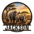 Custom rhino metal sign featuring a family of rhinos in an African savanna at sunset