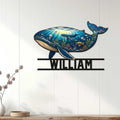 Whale-shaped ocean metal sign displayed as wall decor on a light wood-paneled interior wall