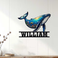 Humpback whale ocean wall decor displayed on a white paneled wall in a bright home interior