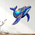 Colorful whale wall decor displayed on a light wood wall in a bright coastal-inspired room