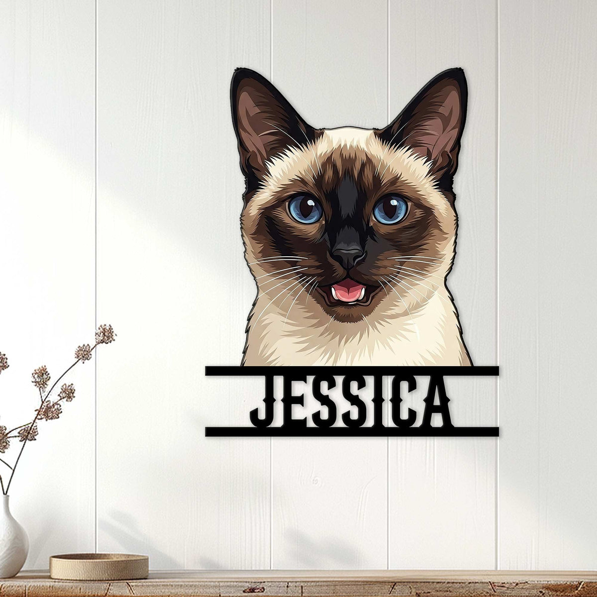 Siamese cat metal wall sign displayed on a light wood-paneled wall in a home interior