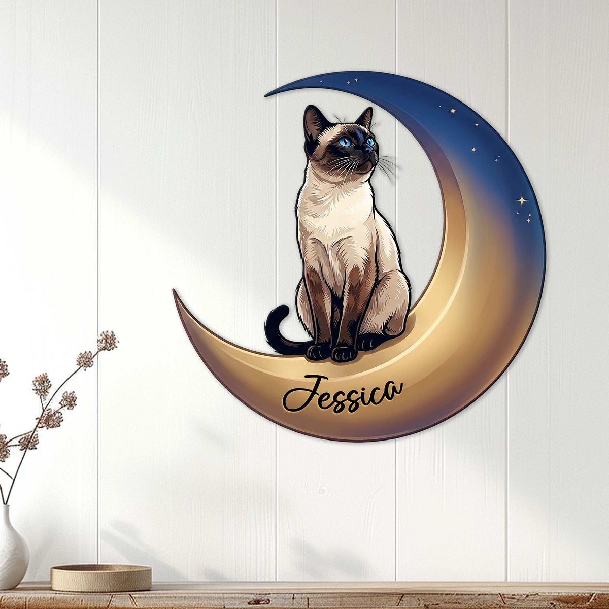 Siamese cat metal wall sign displayed on a light paneled wall in a cozy home setting