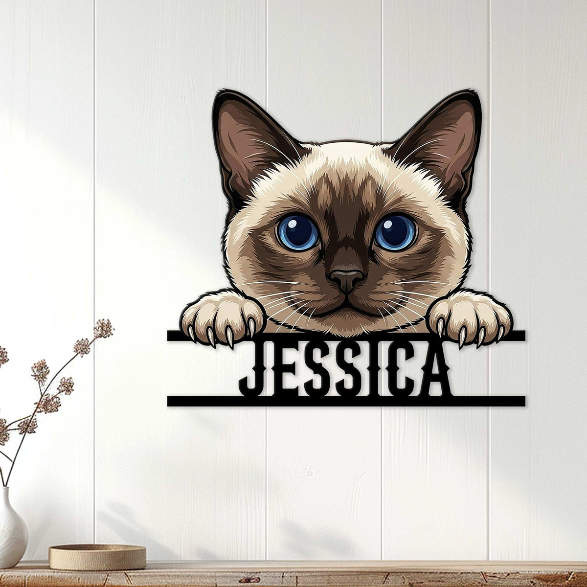 Siamese cat metal wall sign displayed on a light wood-paneled wall in a home interior