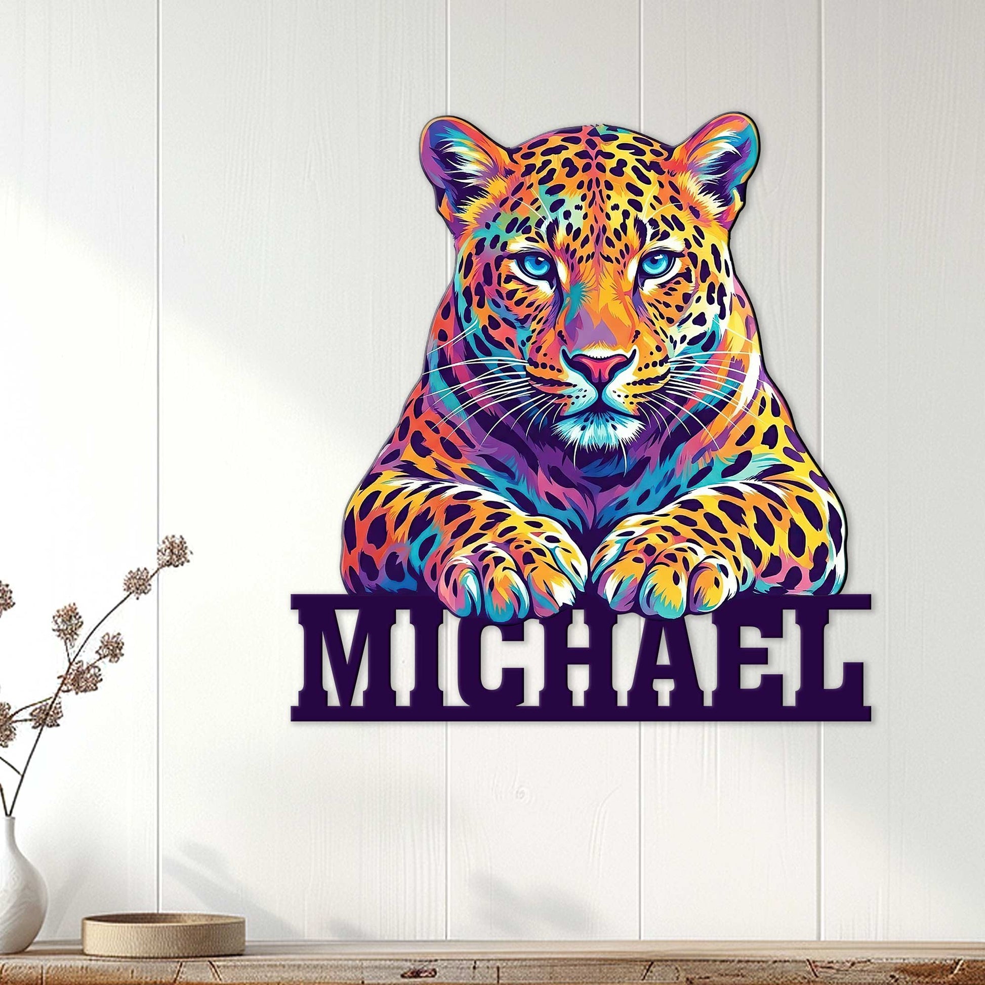 Colorful leopard wall sign displayed on a light wood-paneled wall in a modern home interior