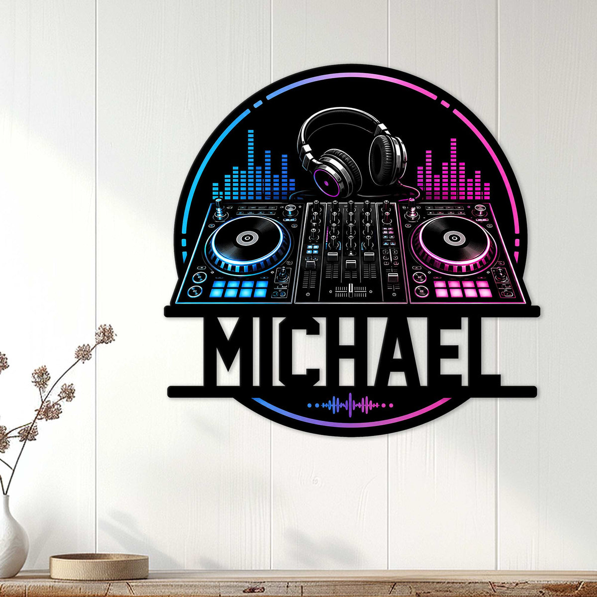 DJ wall sign displayed on a white paneled wall with colorful headphones, turntables, and audio controls
