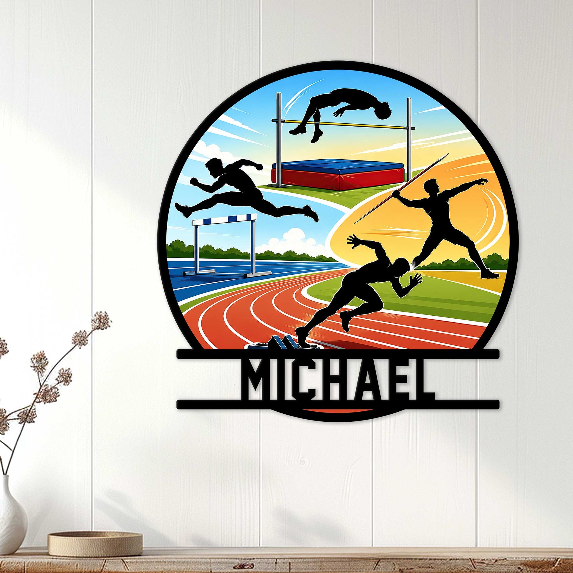 Track and field wall decor displayed indoors with silhouettes of athletes competing in several events