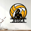 Water polo wall decor displayed on a light paneled wall, featuring a female player silhouette and orange ball