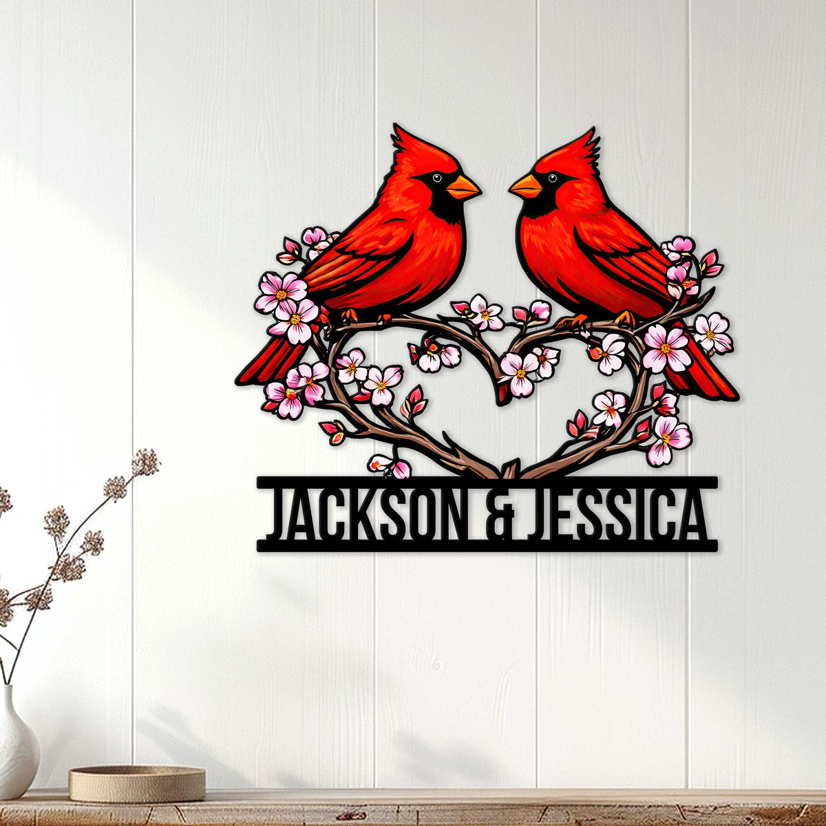 Cardinal wall decor displayed on a white wood wall above a console table
