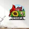 Cardinal bird wall decor displayed on a light wood wall with a bright sunflower and farm scene