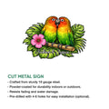 Cut metal parrot sign featuring a colorful lovebird pair surrounded by tropical foliage