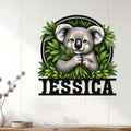 Koala wall sign displayed on a white paneled wall in a bright, nature-inspired home setting