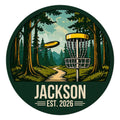 Custom disc golf metal sign featuring a flying disc and basket on a wooded course