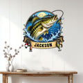 Bass fishing metal sign displayed on a light paneled wall above a wood console in a home decor setting