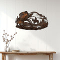 Cowboy metal wall sign displayed on a white paneled wall above a rustic console table