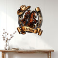 Western cowboy wall sign displayed above a console table, featuring a rider and horse in a horseshoe frame