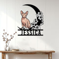 Sphynx cat wall sign displayed on a bright paneled wall above a console table