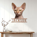 Sphynx cat metal sign displayed on a bright wood-paneled wall above a console table