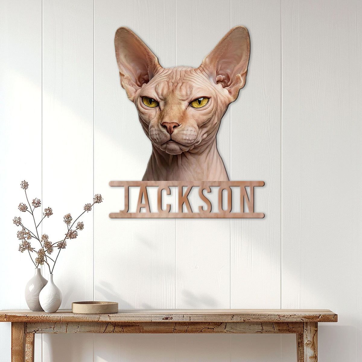 Sphynx cat metal sign displayed on a bright wood-paneled wall above a console table