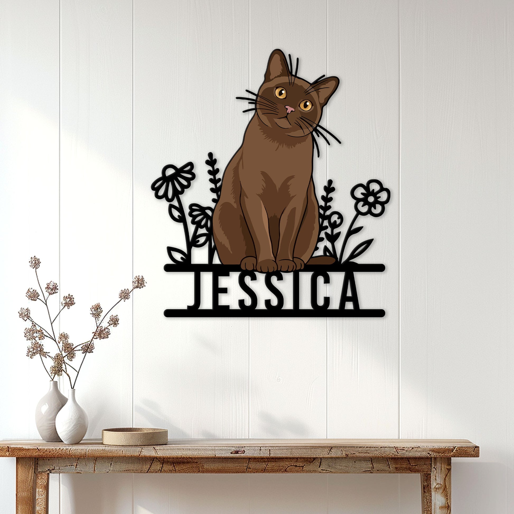 Burmese cat metal sign displayed on a light paneled wall above a console table