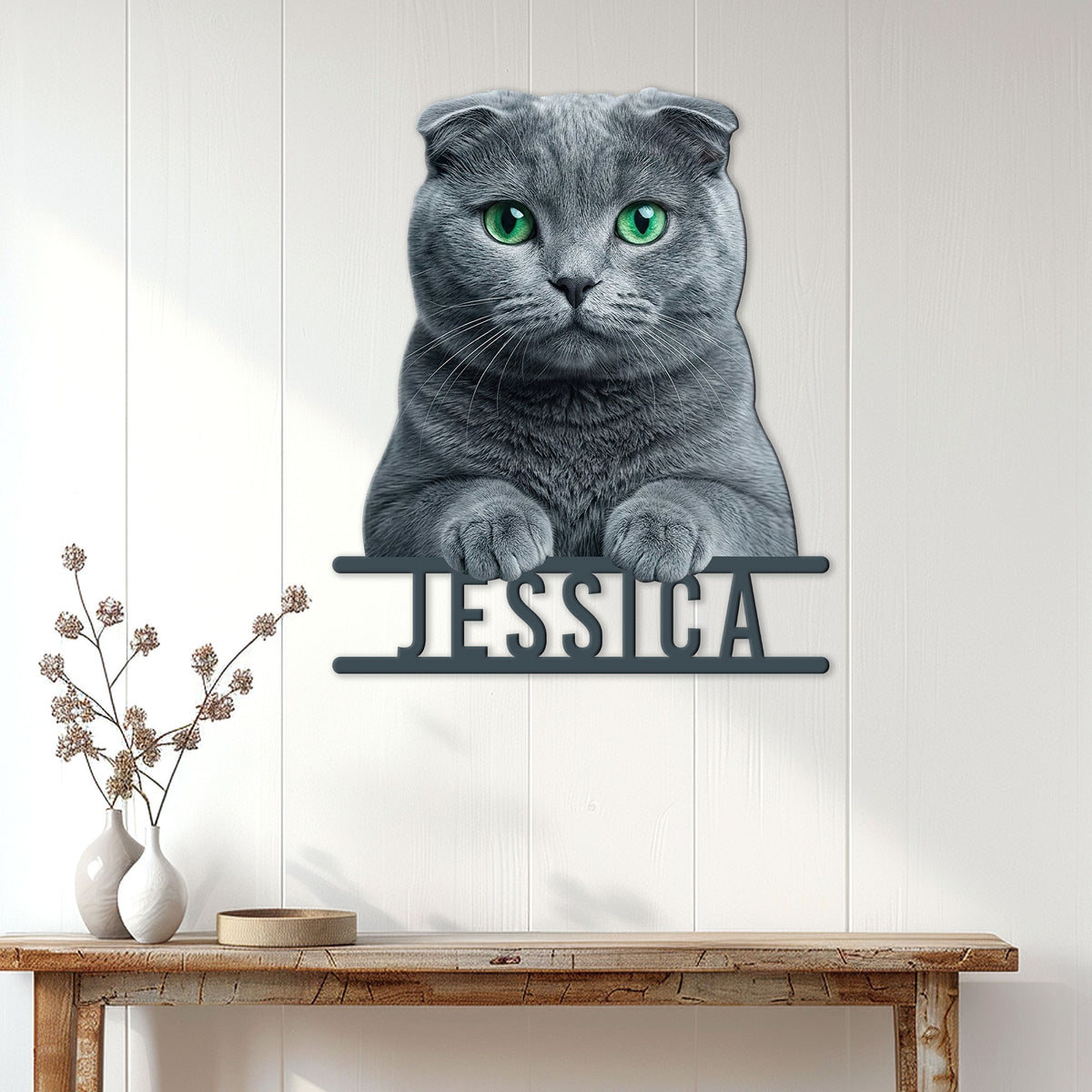 Scottish Fold cat metal wall sign displayed on a bright wood-paneled entryway above a console table