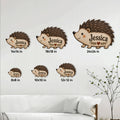 Hedgehog-shaped metal sign shown in multiple size options against a bright living room wall